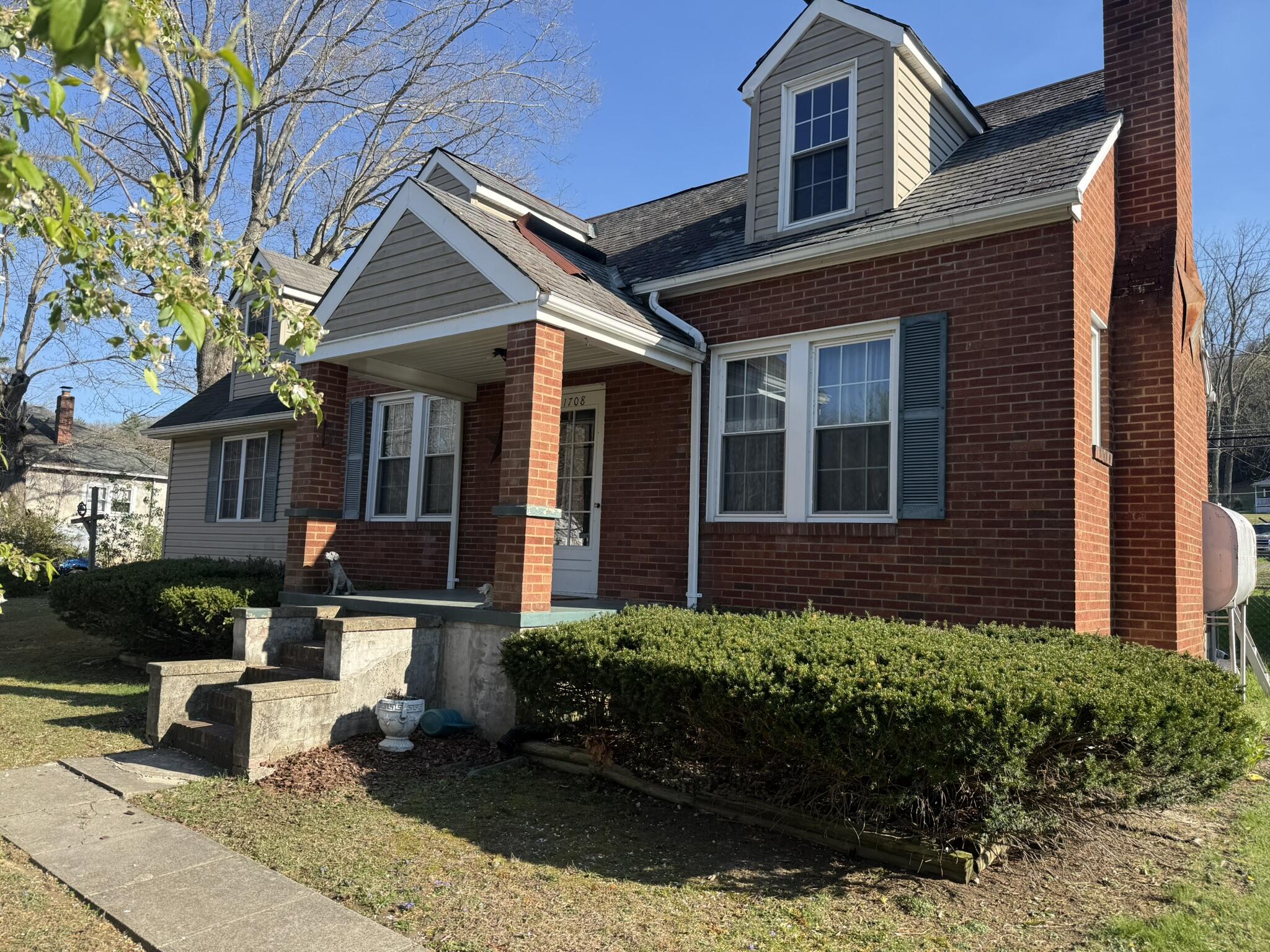 1708 Midland Trail Covington, VA 24426 - Photo 2 of 21 a front view of a house with a yard and potted plants