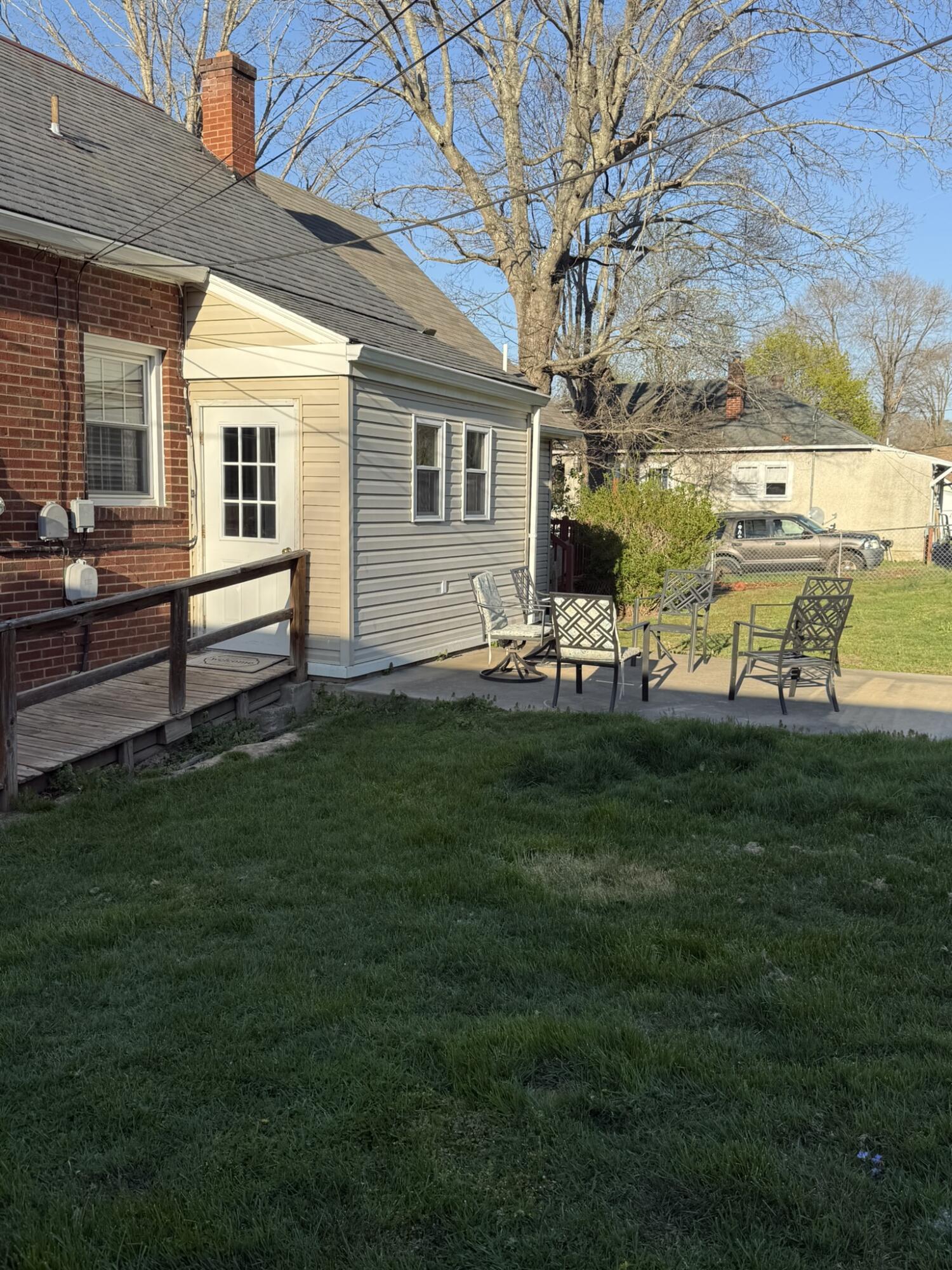 1708 Midland Trail Covington, VA 24426 - Photo 6 of 21 a front view of a house with a garden and sitting area