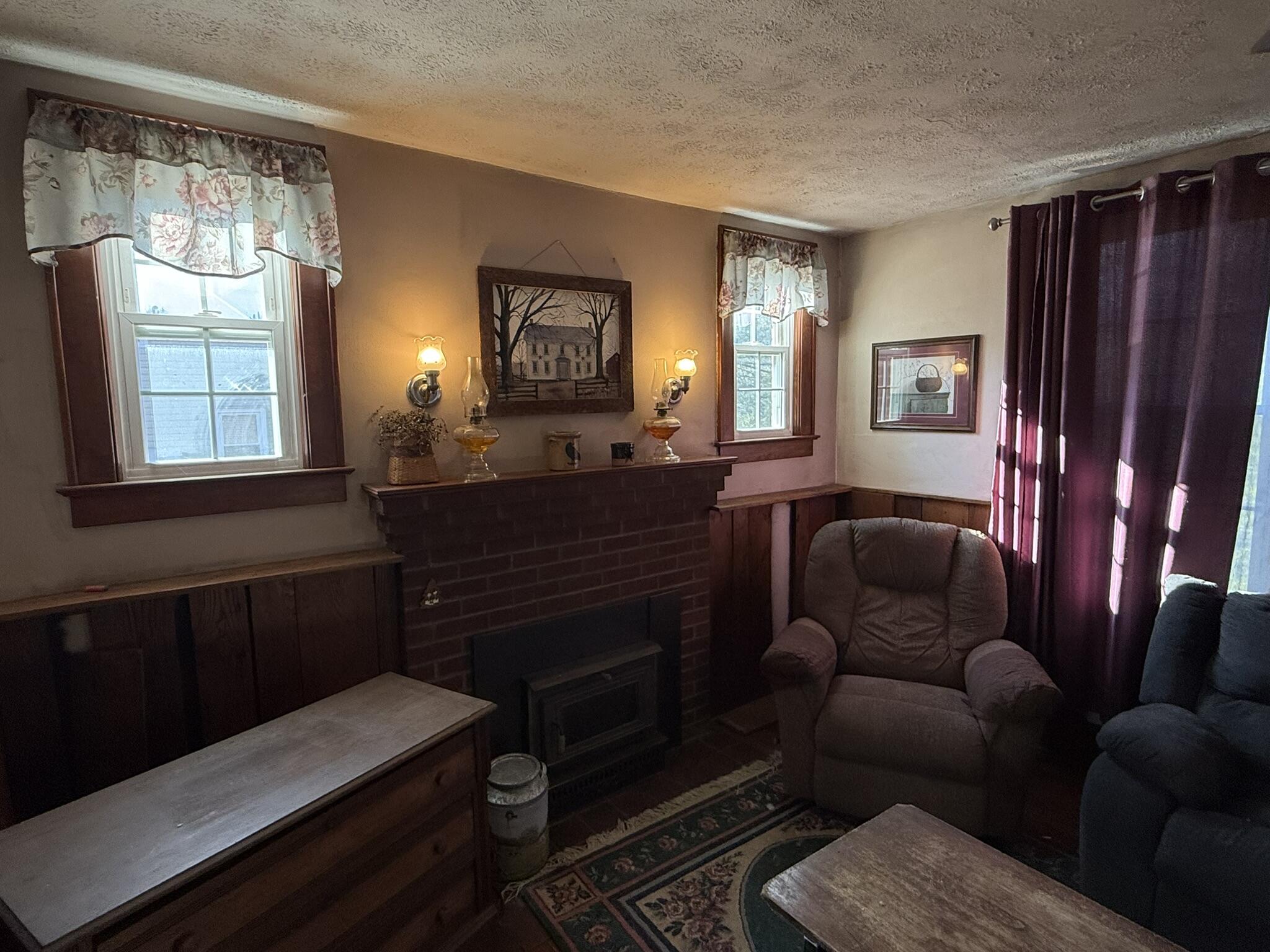 1708 Midland Trail Covington, VA 24426 - Photo 10 of 21 a living room with furniture a lamp a rug and a window