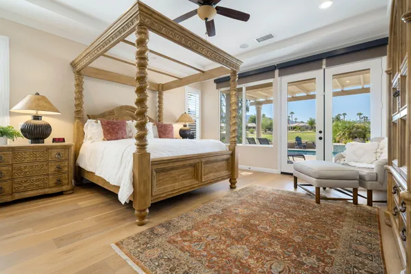 a bedroom with a bed chair and window