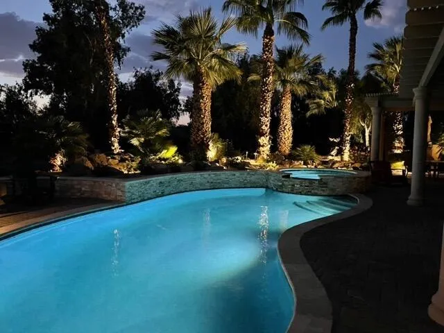 a view of a swimming pool with an outdoor space and seating area