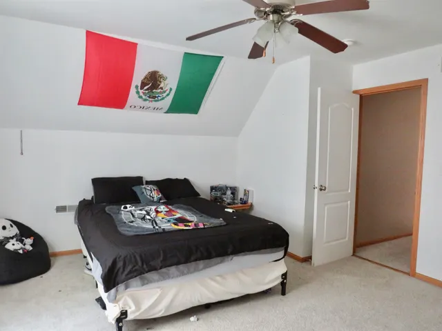 a bed room with a bed and a couch