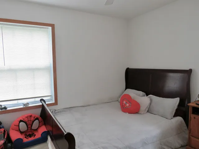 a bedroom with a bed and a closet