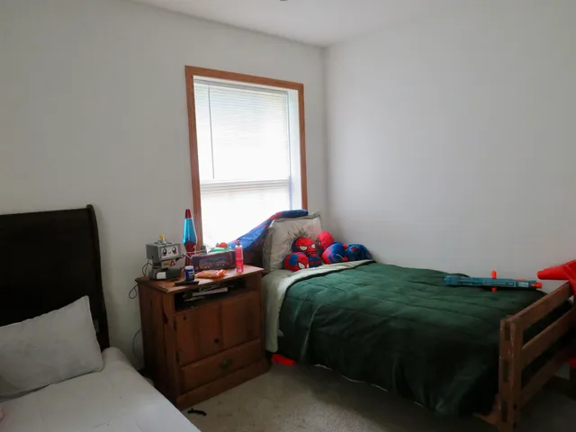 a bath tub sitting in a bathroom next to a window