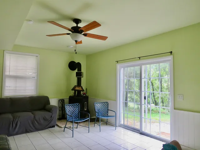 a living room with furniture and a window