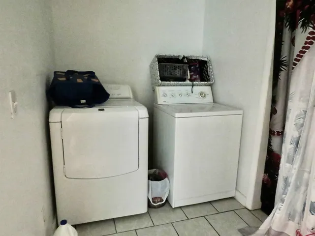 a front view of a house with outdoor seating