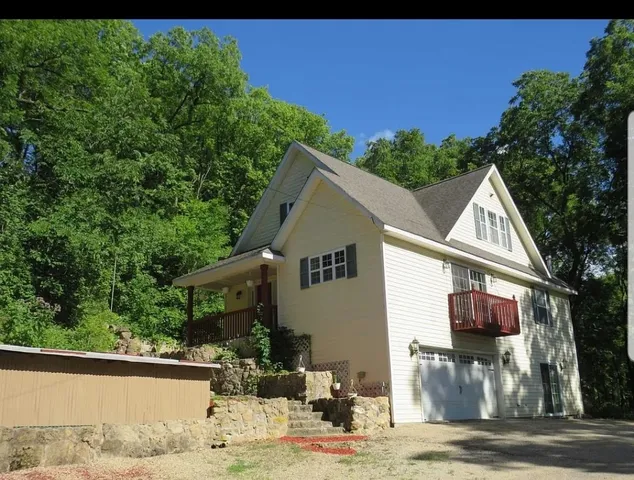a view of house with yard