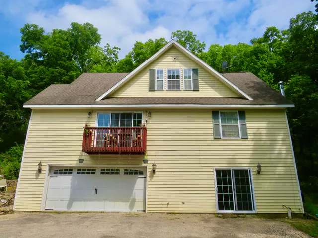 a backyard of a house with lots of green space