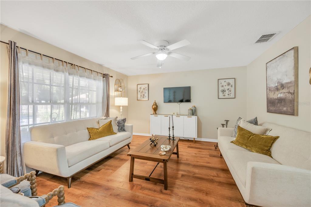 10318 Summerview Circle Riverview, FL 33578 - Photo 16 of 39 a living room with furniture and a flat screen tv