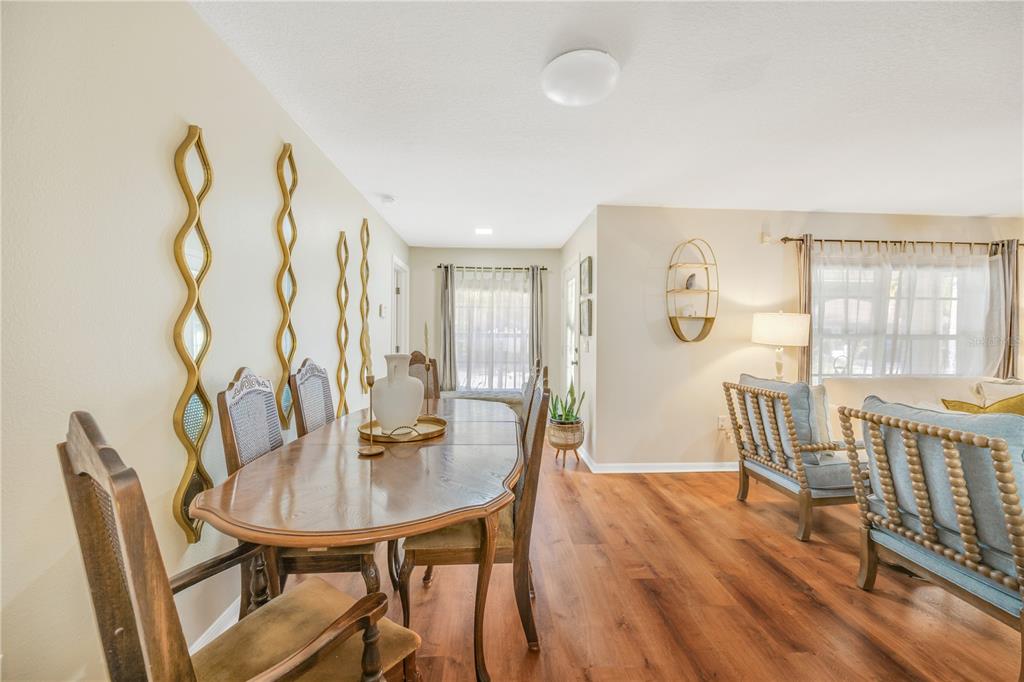 10318 Summerview Circle Riverview, FL 33578 - Photo 18 of 39 a view of a dining room with furniture and wooden floor