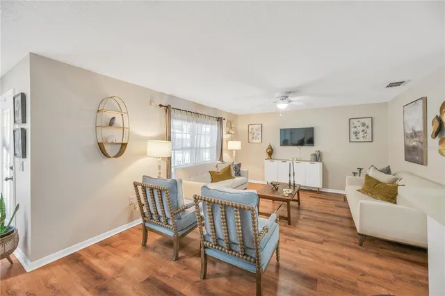 a view of a livingroom with furniture and wooden floor