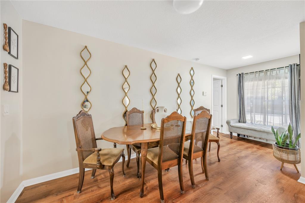 10318 Summerview Circle Riverview, FL 33578 - Photo 26 of 39 a view of a dining room with furniture and window