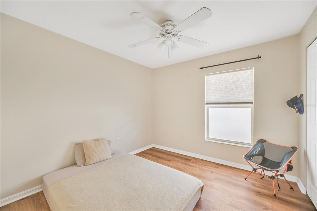 10318 Summerview Circle Riverview, FL 33578 - Photo 36 of 39 a bedroom with a bed and a window