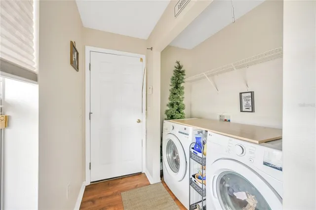 a view of storage and utility room with washer and dryer