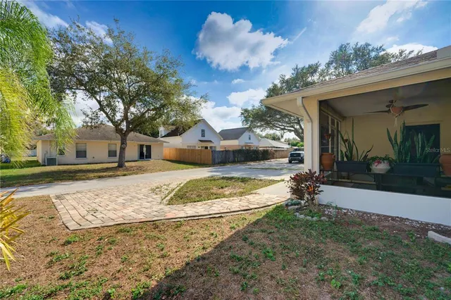 a view of a house with a yard