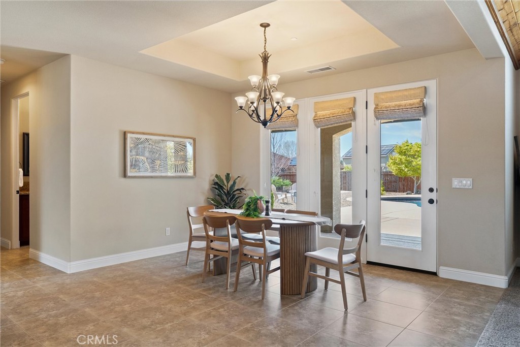 3882 Spyglass Road Chico, CA 95973 - Photo 23 of 71 Dining Area, doors lead to the covered patio by the pool