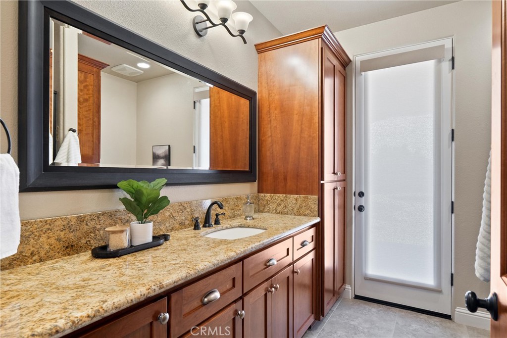 3882 Spyglass Road Chico, CA 95973 - Photo 31 of 71 Guest Bathroom down the hall from kitchen. Exit door goes to backyard