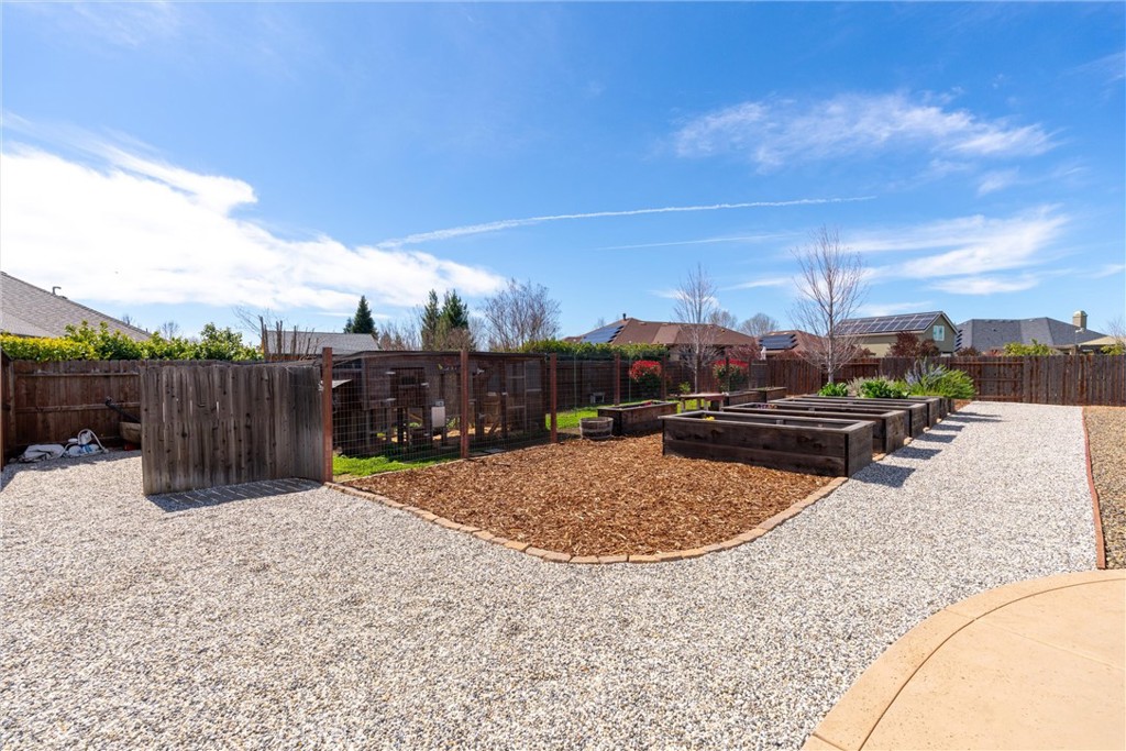 3882 Spyglass Road Chico, CA 95973 - Photo 56 of 71 Chicken Coop on the left, irrigated/planted/garden beds on the right