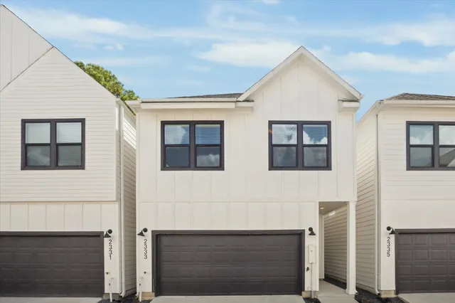 a front view of a house with garage