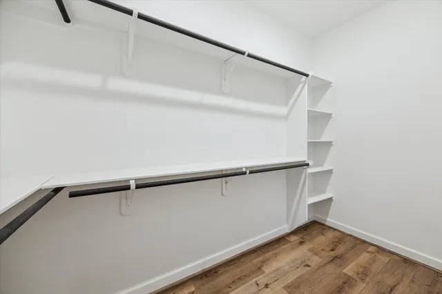 a view of an empty walk in closet