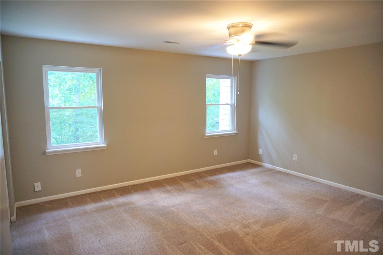5710 Pool Side Drive Raleigh, NC 27612 - Photo 5 of 6 a view of an empty room with a window