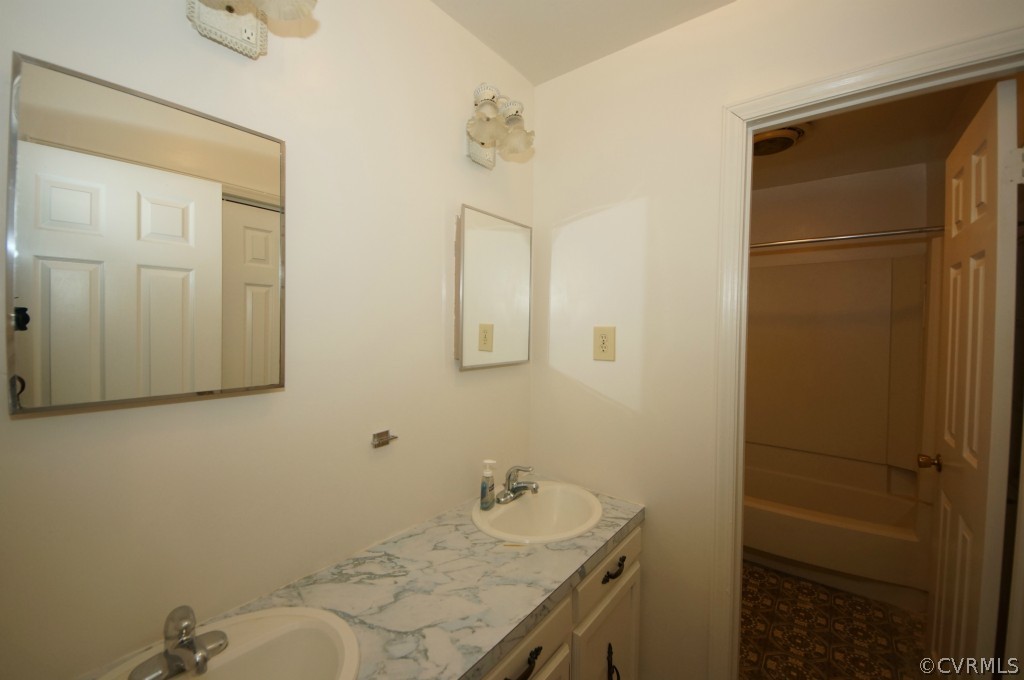2244 Pony Farm Road Maidens, VA 23102 - Photo 11 of 13 a bathroom with a granite countertop sink and a mirror