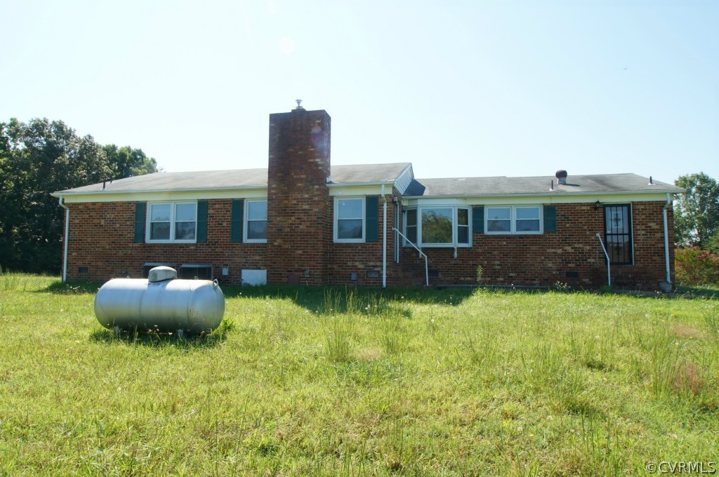 2244 Pony Farm Road Maidens, VA 23102 - Photo 2 of 13 a front view of a house with a yard and garage