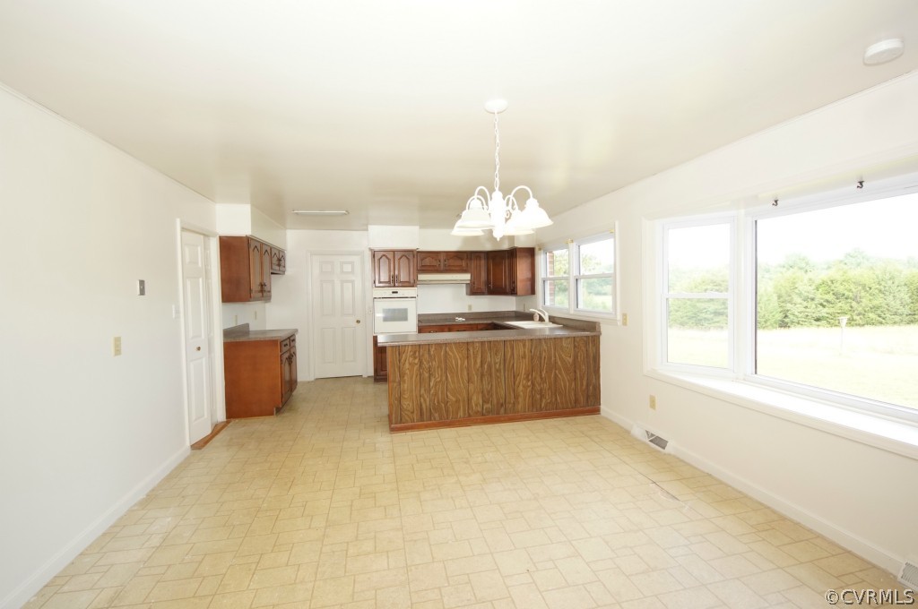 2244 Pony Farm Road Maidens, VA 23102 - Photo 7 of 13 a kitchen with stainless steel appliances a sink a counter top space cabinets and a window