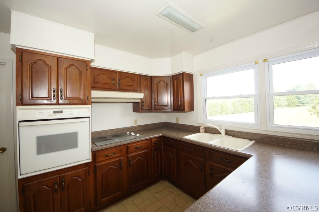 2244 Pony Farm Road Maidens, VA 23102 - Photo 8 of 13 a kitchen with granite countertop cabinets stainless steel appliances a sink and a window
