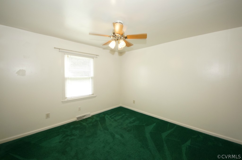 2244 Pony Farm Road Maidens, VA 23102 - Photo 10 of 13 an empty room with a window and a fan