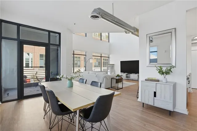 a view of a livingroom with furniture and a flat screen tv