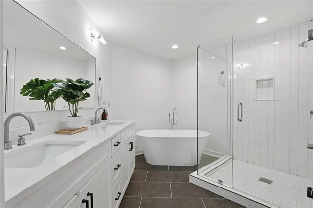 a bathroom with a bathtub sink and toilet