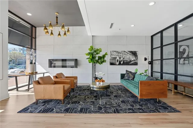 a living room with furniture wooden floor and a fireplace