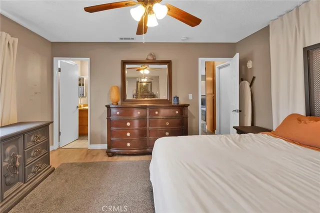 a bedroom with a bed and a dresser