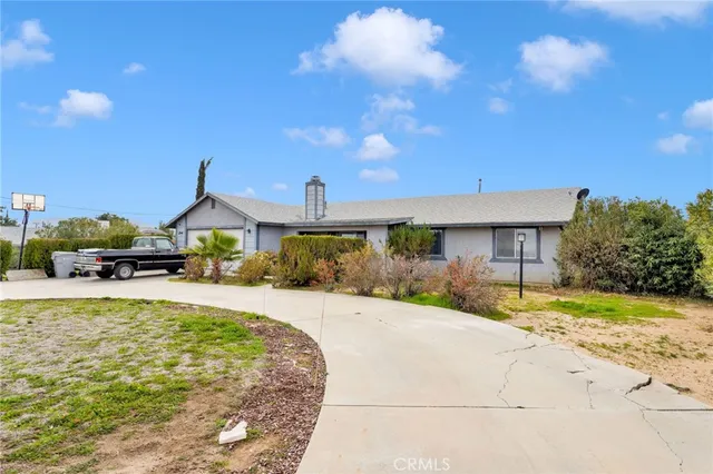 a front view of a house with swimming pool having outdoor seating