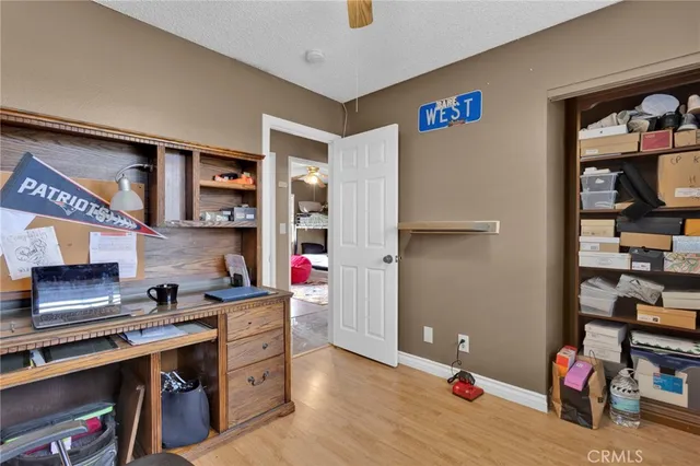 a kitchen with a refrigerator and cabinets