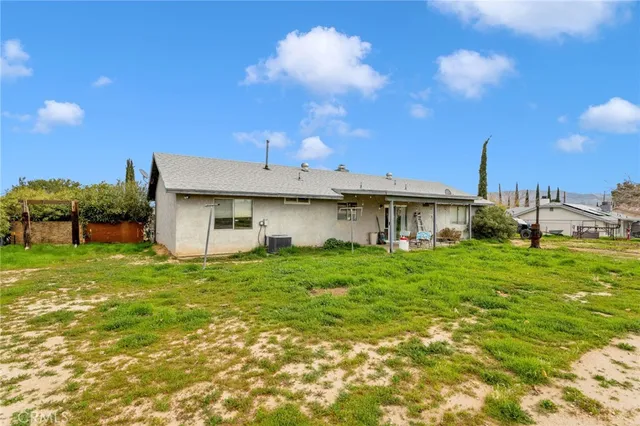 a view of a house with a back yard