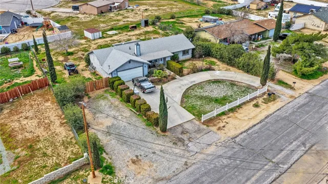 an aerial view of residential house with outdoor space