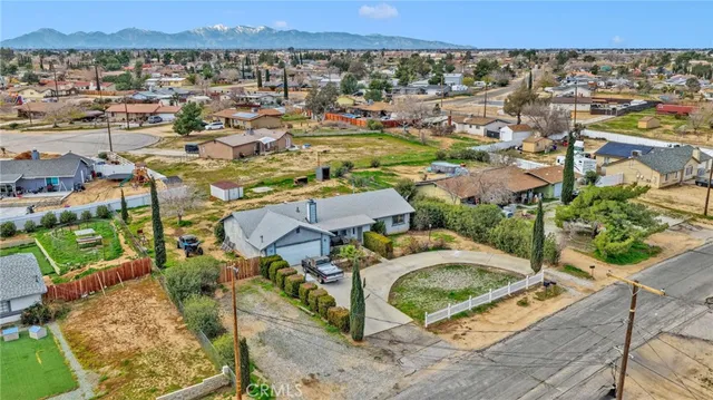 an aerial view of a house with a swimming pool