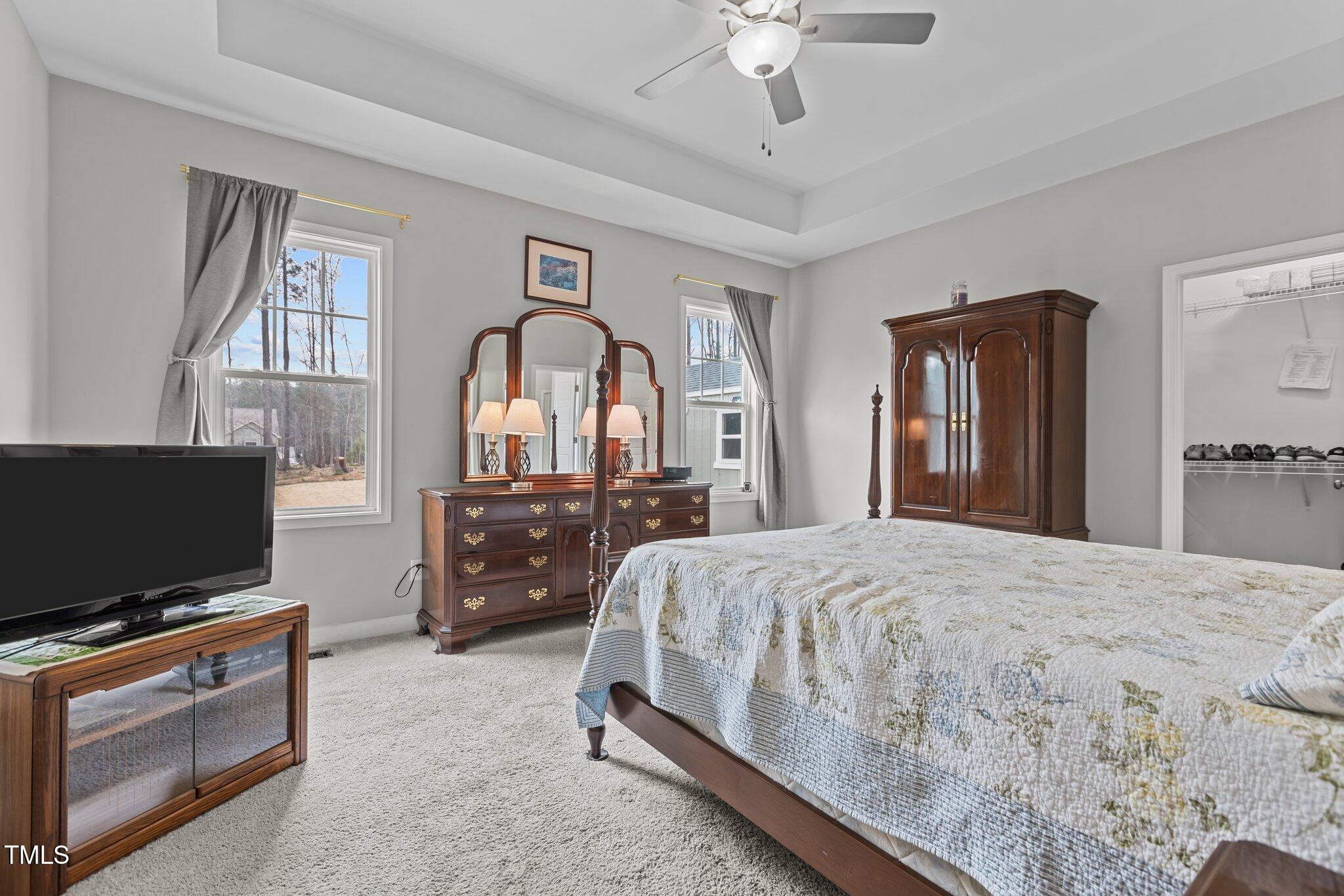 240 Northview Drive Middlesex, NC 27557 - Photo 24 of 58 a bedroom with a bed and a flat screen tv