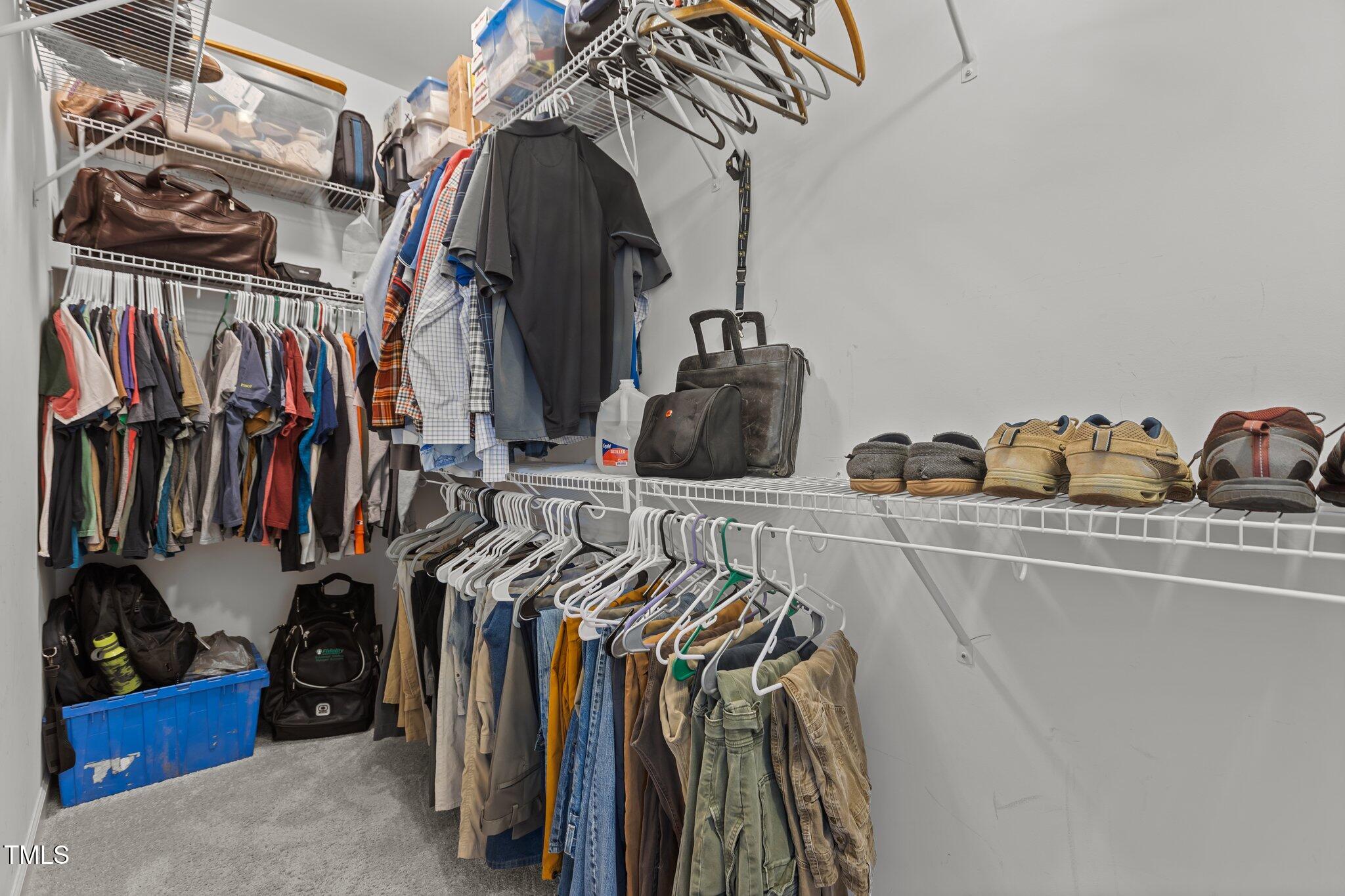 240 Northview Drive Middlesex, NC 27557 - Photo 27 of 58 a view of walk in closet with clothes and shoes
