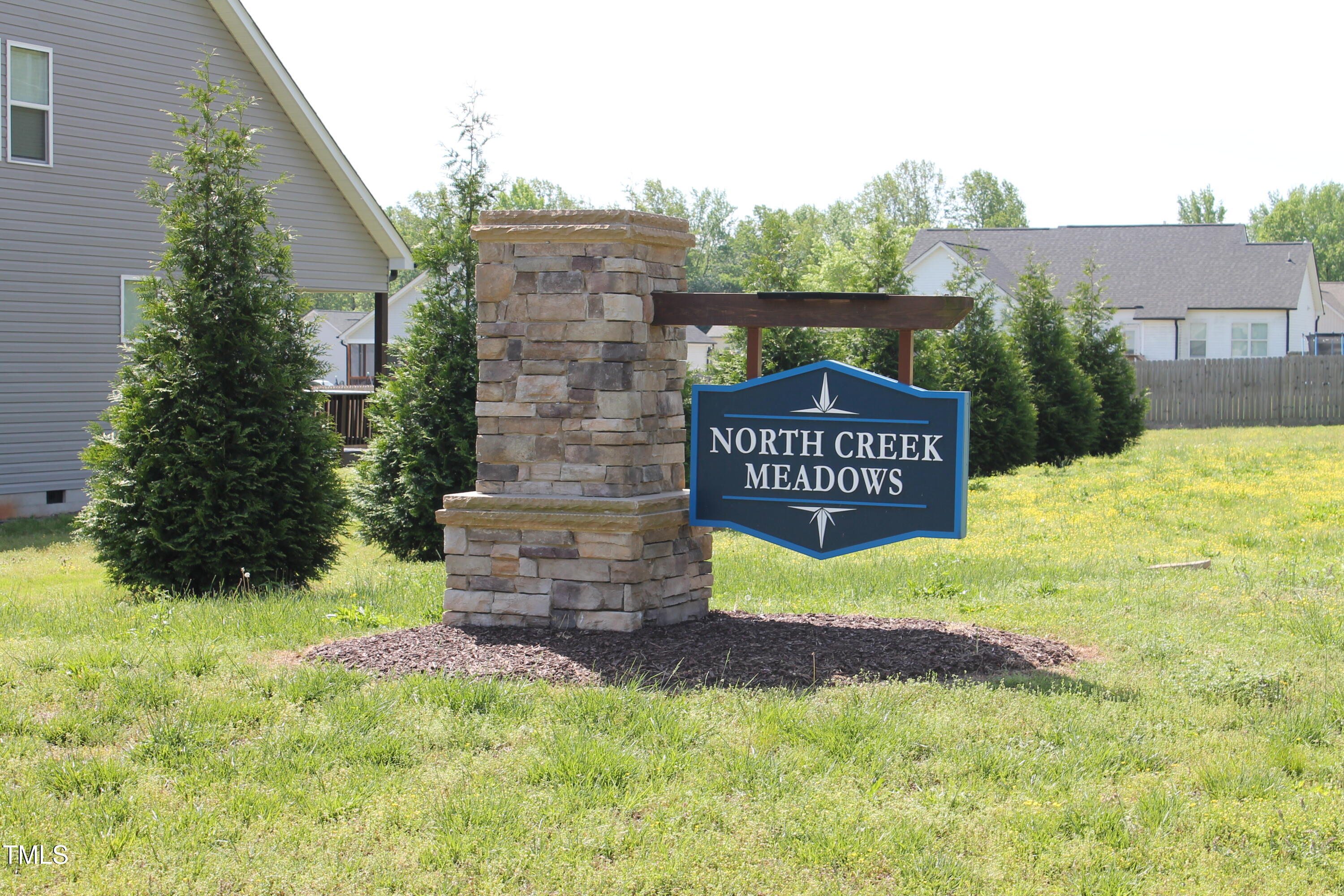 240 Northview Drive Middlesex, NC 27557 - Photo 2 of 58 a sign of golf club on a wall under a tree