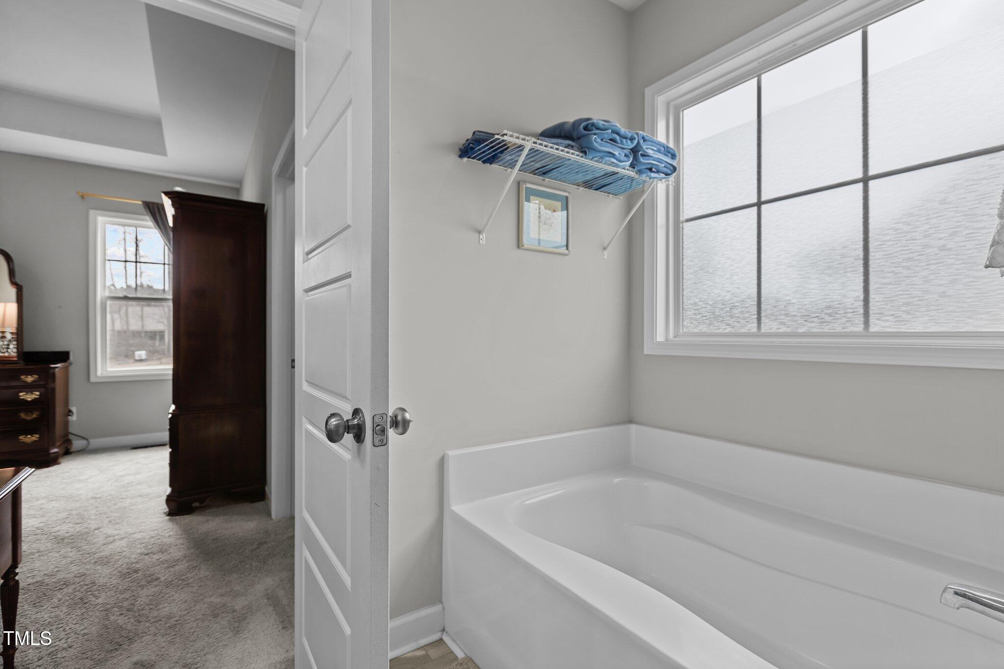 240 Northview Drive Middlesex, NC 27557 - Photo 28 of 58 a bathroom with a bathtub and a shower