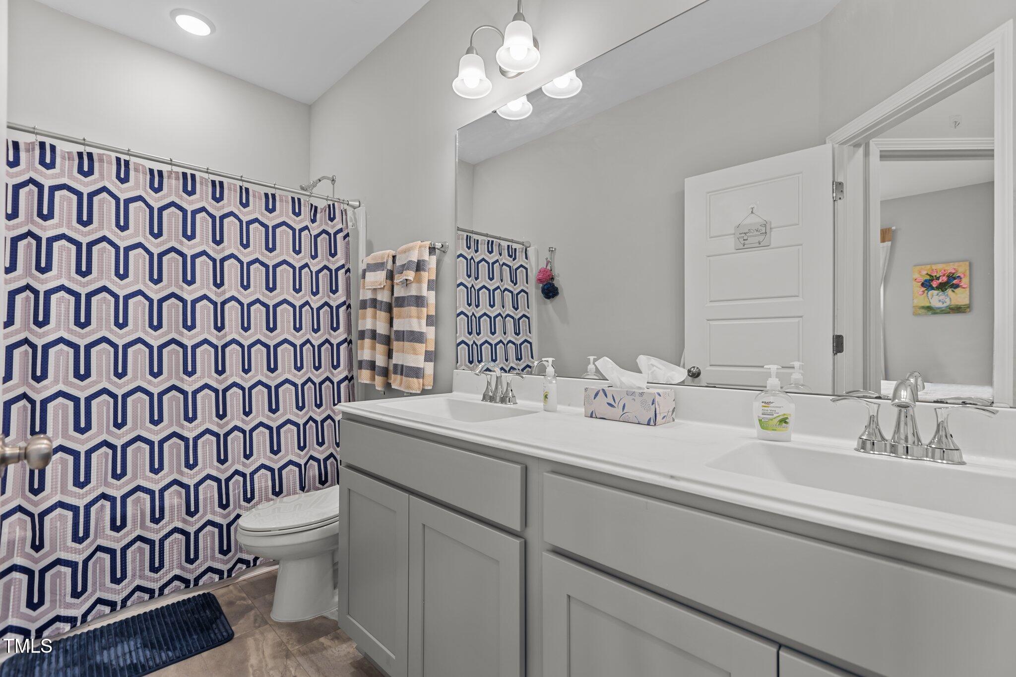 240 Northview Drive Middlesex, NC 27557 - Photo 36 of 58 a bathroom with a sink toilet and shower