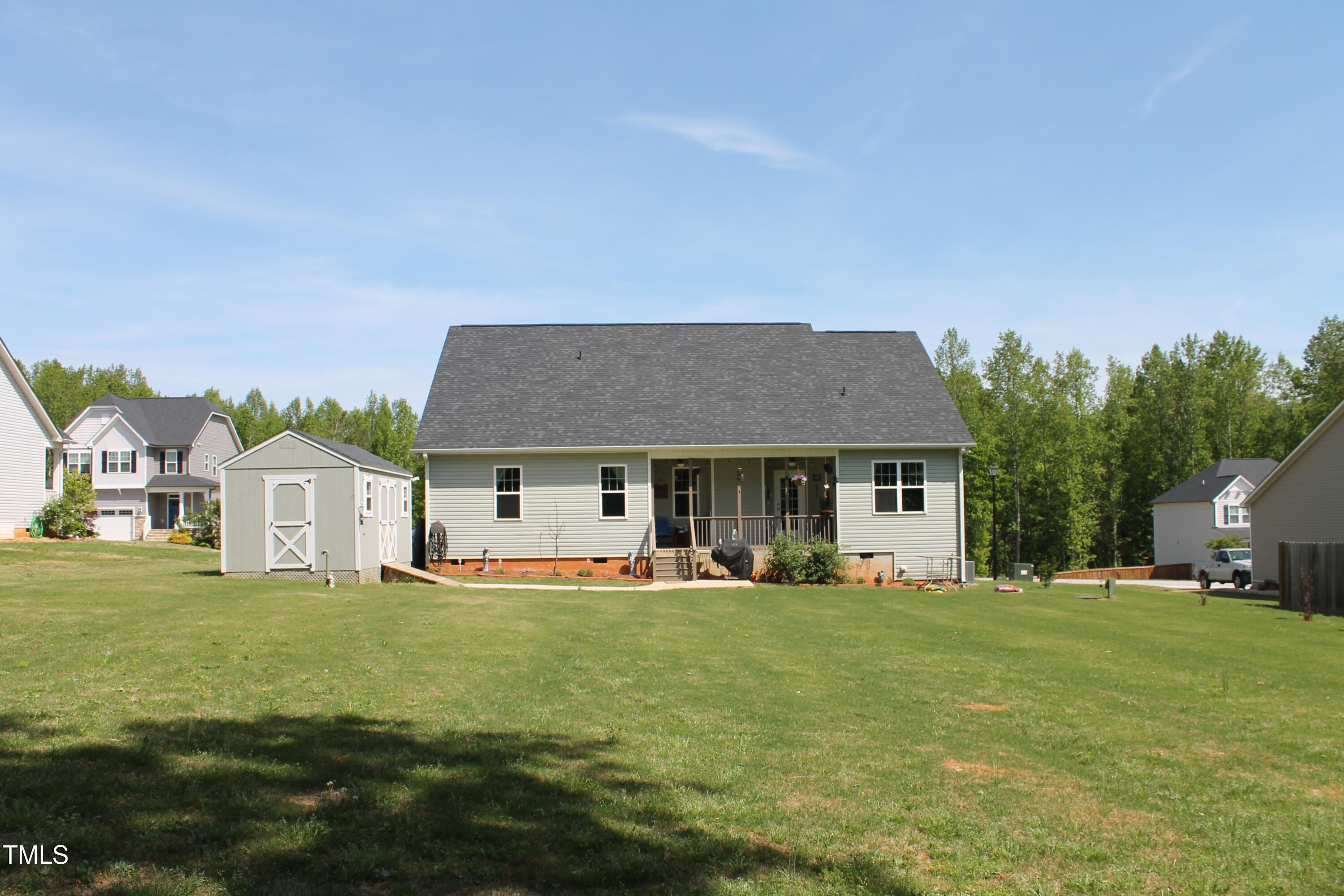 240 Northview Drive Middlesex, NC 27557 - Photo 42 of 58 a front view of house with yard and trees in the background