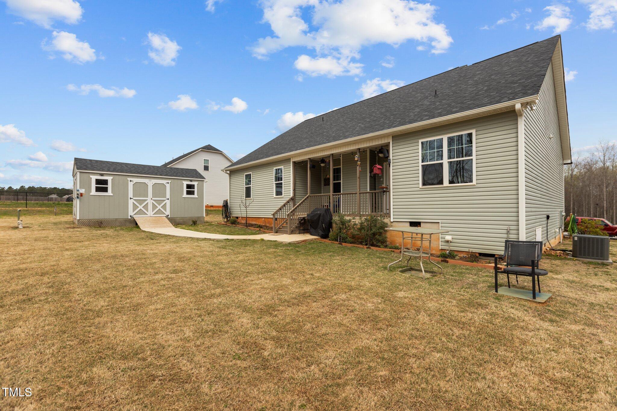 240 Northview Drive Middlesex, NC 27557 - Photo 44 of 58 a backyard of a house with table and chairs