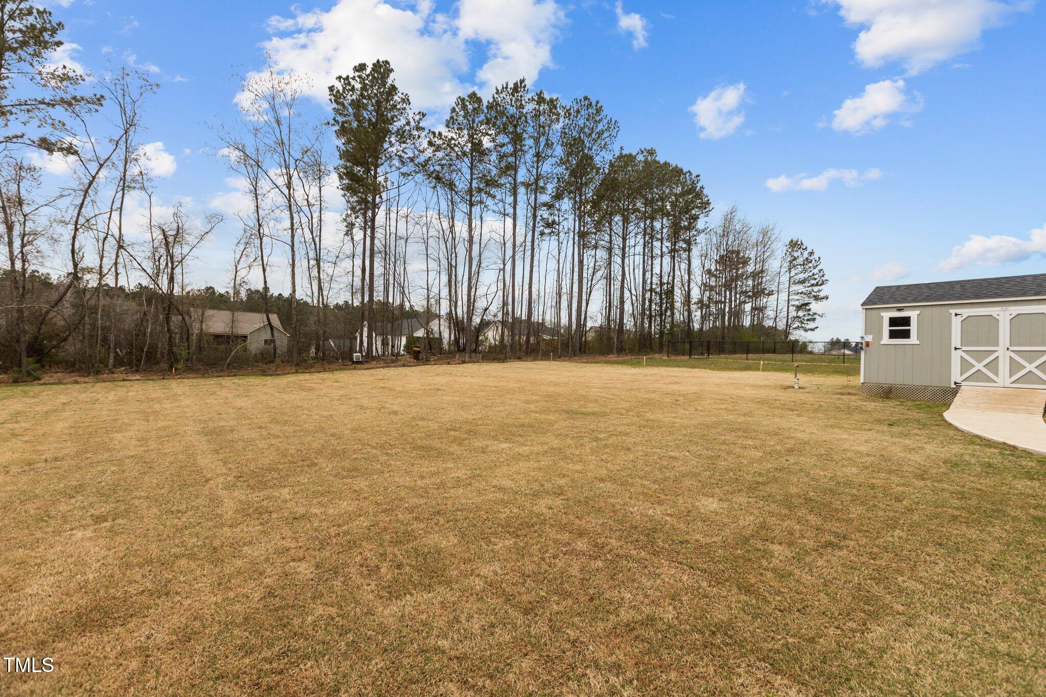 240 Northview Drive Middlesex, NC 27557 - Photo 46 of 58 a view of a yard with palm trees