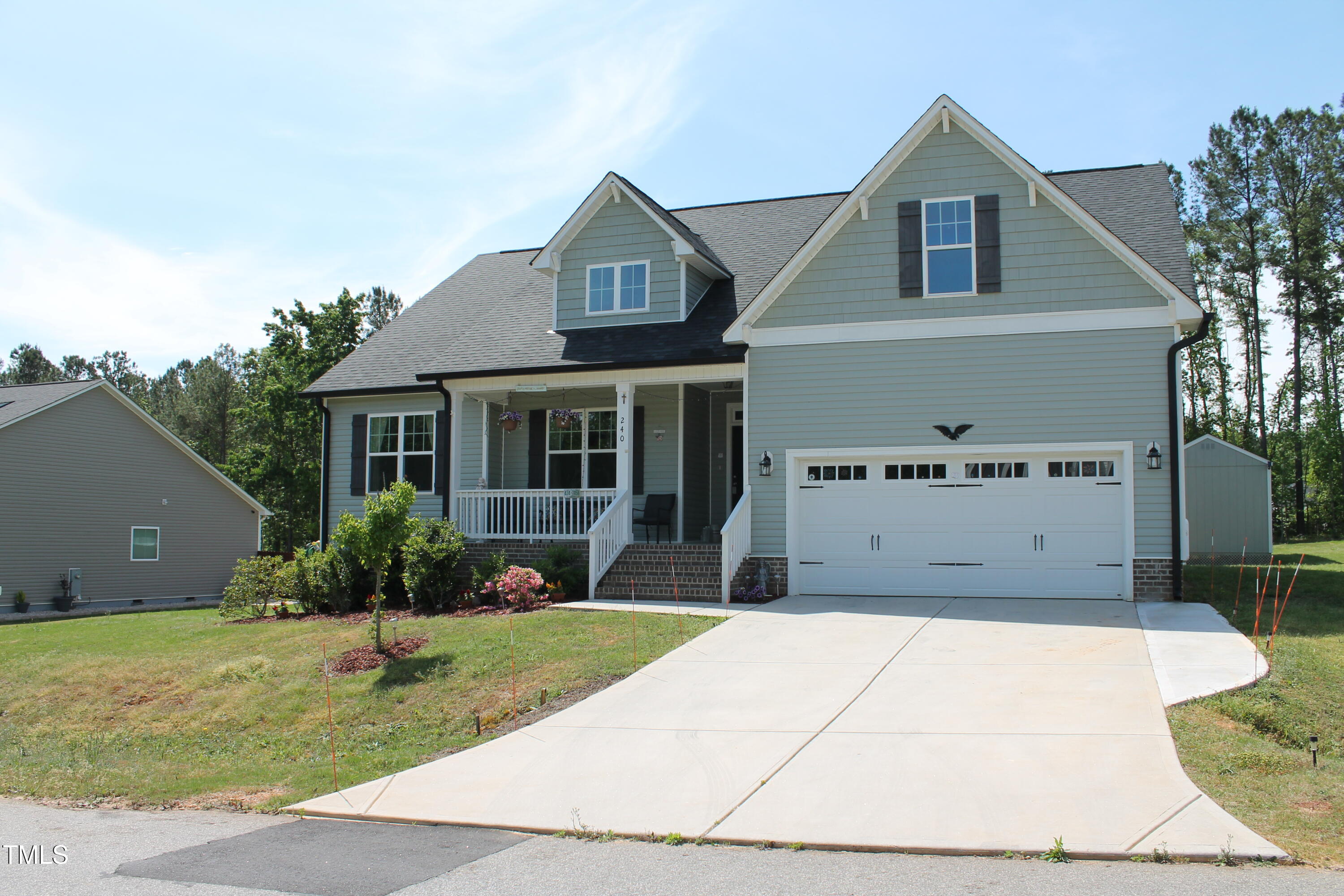 240 Northview Drive Middlesex, NC 27557 - Photo 3 of 58 a front view of a house with garden