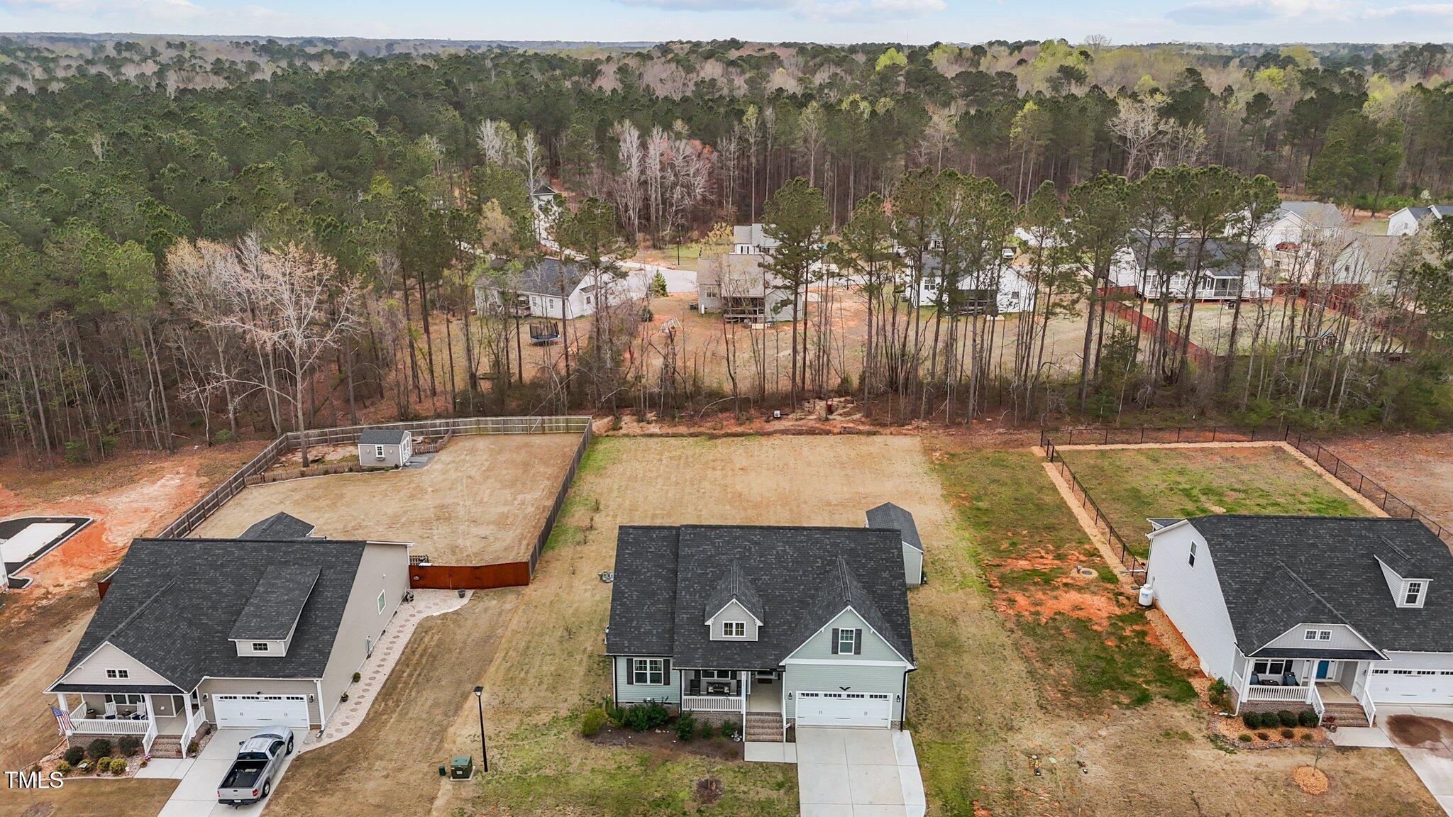 240 Northview Drive Middlesex, NC 27557 - Photo 7 of 58 swimming pool view with plants and large trees