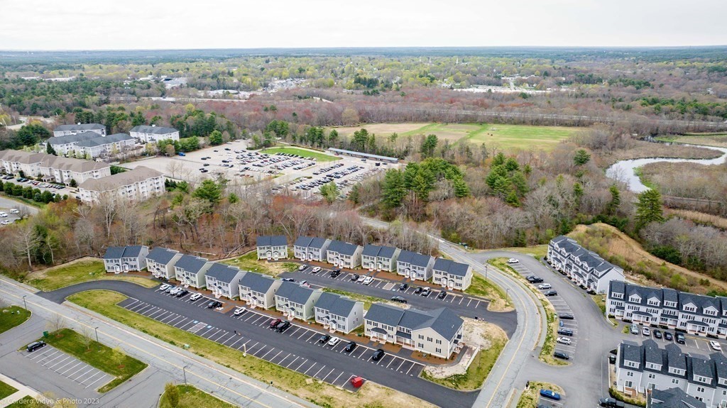 6 Rivers Edge Way, Unit 6 Assonet, MA 02702 - Photo 3 of 19 a view of a city with tall buildings